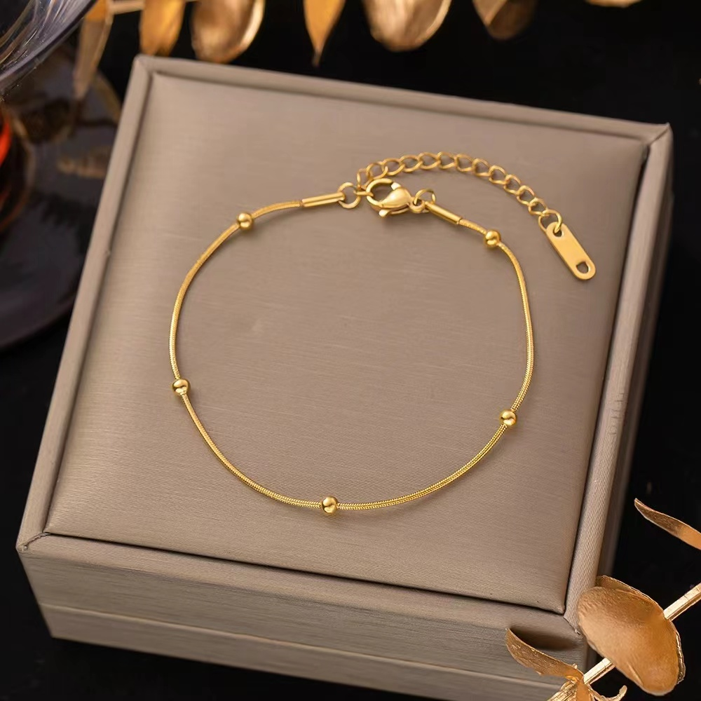 Stainless steel bracelet with polished gold finish